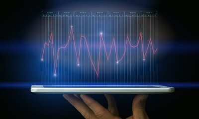 Poster - Male Hand Holding Digital Tablet With Economic Chart On Virtual Screen