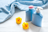 Set of baby hygiene and bath items with shampoo bottle and soap