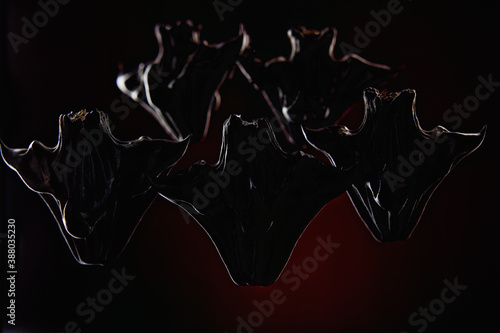 Fotografía group of horned demons on a dark background. High quality photo