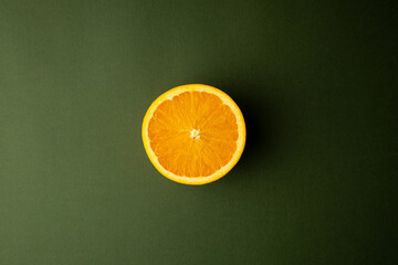 Wall Mural - orange fruit with dark green background