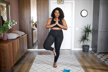 Fat Overweight Black Woman Keep Balance, Stand On One Leg, Yoga Time At Home. Concentrated On Yoga, Meditation. Healthy Lifestyle