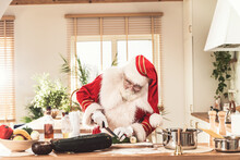 Santa Claus Cooking Vegetarian Food In Kitchen.