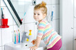 © Irina Schmidt - Cute little toddler girl washing hands with soap and water in bathroom. Adorable child learning cleaning body parts. Hygiene routine action during viral desease. kid at home or nursery.