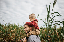 Father And Son Exploring Corn Maze In The Fall