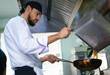 © Natalia - Young chef is preparing a typical dish of pasta in the restaurant. She brings to the table good and tasty cuisine
