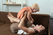 © somemeans - Mom plays with her little daughter. Nanny is having fun with the child.