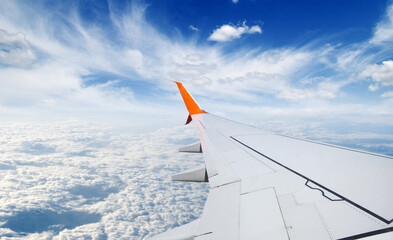 View from airplane window with blue sky