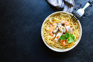 spaghetti seafood pasta shrimp, mussels, squid and more second course top view copy space for text food background rustic