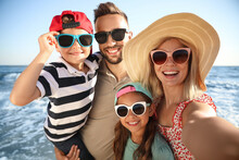 Happy Family Taking Selfie On Beach Near Sea. Summer Vacation