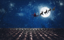 Santa Claus On His Sleigh, Pulled By Reindeer, Flying At Night To Deliver Gifts
