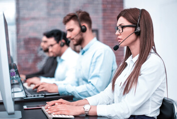 young employee call center talking with the client