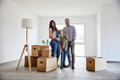 © MiJo/Westend61 - Family standing on floor of domestic room during move in day