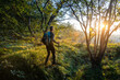 © 27exp/Westend61 - Male hiker with backpack and hiking pole walking in forest, Orobie, Lecco, Italy