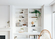 © Sophia Hsin/Stocksy - Beautiful interiors of minimal home with bookshelf, furniture, rug and plants