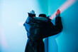 © Sergey Filimonov/Stocksy - Cyberpunk woman standing under red illumination