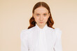 © Sergey Filimonov/Stocksy - Ginger woman in white retro blouse