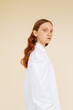 © Sergey Filimonov/Stocksy - Young ginger model in white shirt