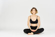 © SHOTPRIME STUDIO - Yoga asana woman crossed legs meditation light background room