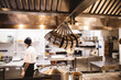 © Sergey Filimonov/Stocksy - Professional utensil and chef in kitchen