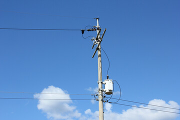 electric pole with blue sky background