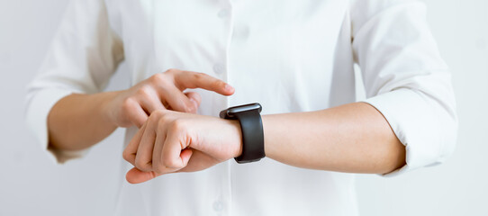 Hand touching screen on smartwatch to unlock, Concept digital security and private data access in technology.