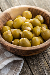 Poster - Pitted green olives stuffed with almonds in bowl.