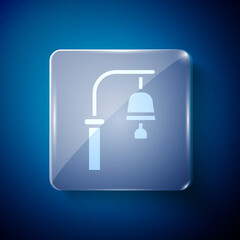 Poster - White Train station bell icon isolated on blue background. Square glass panels. Vector.