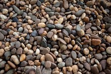 Various Shapes And Color Small Pebbles Stone On Ground