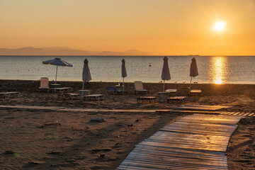 Wall Mural - sunrise over a sandy beach in rhodes