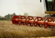 © Volodymyr_sh - Combine harvester agriculture machine harvesting golden ripe wheat field. Agriculture. Combine harvester harvesting wheat with dust straw in the air. Heagy agricultural machinery.