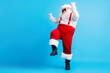 © deagreez - Full length photo of cool hipster fat santa claus dance x-mas christmas tradition discotheque wear suspenders overall sunglass boots isolated over blue color background