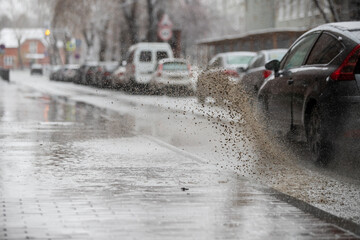 Melted dirty snow on the road