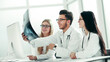 © yurolaitsalbert - doctors experts discuss x-ray,sitting at the table