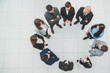 © yurolaitsalbert - top view. group of business people standing in a circle.
