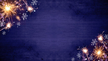 Festive Silvester Party/ New year / New Year's Eve / Holiday background - Top view / above view from sparklers, bokeh lights and ice crystals isolated on dark blue purple wooden table, wood texture