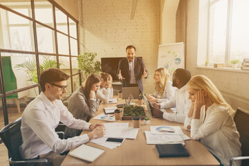 Wall Mural - Photo of business people diversity colleagues mature boss guy scolding managers year budget fail dismissed everyone company ruin devastation unhappy out of himself office indoors