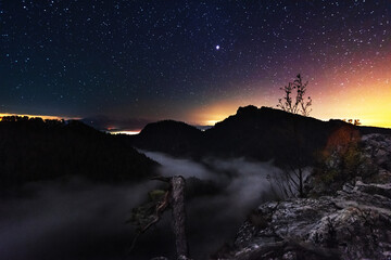 Wall Mural - starry nights in the high tatras with a tourist in a tent on top