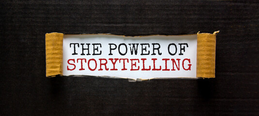 The words 'the power of storytelling' appearing behind torn black paper. Beautiful background. Business concept.