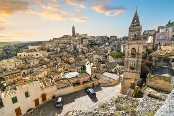 Wall Mural - View of the Sasso Barisano, tower, old town, sassi caves and cathedral from the Convent of San Agostino, in the ancient city of Matera, Italy