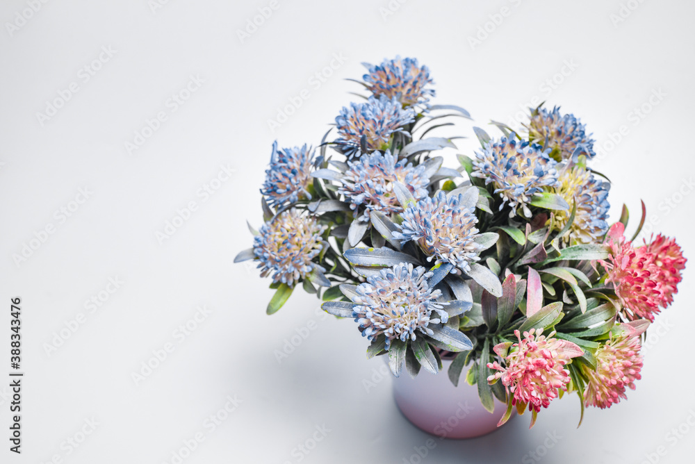 Colorful flowers bouquet in a vase on a gray background. Valentine card. Template greeting card for Valentine's Day. Spring card for Mother's Day or Women's Day. Greeting card with flowers, copy space