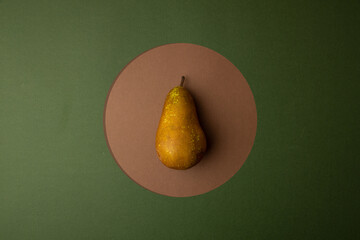 Wall Mural - conference pear, on green and brown background