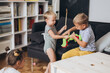 © cherryandbees - kids arguing and fighting about toy at home