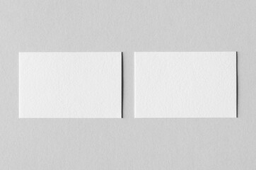 textured business card mockup on a grey background. 85x55 mm.