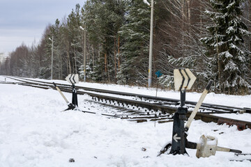 Wall Mural - Railway in winter. Snow-covered railway tracks.