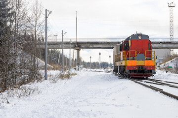 Wall Mural - Train in winter. Old diesel locomotive on the railway.