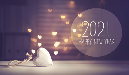 Wall Mural - New Year 2021 message with a white heart with heart shaped lights