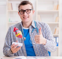 Wall Mural - Medical student studying heart in classroom during lecture