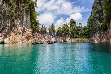 Wall Mural - Beautiful mountains lake river sky and natural attractions in Ratchaprapha Dam at Khao Sok National Park, Surat Thani Province, Thailand.