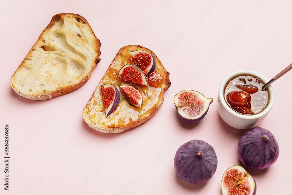 Tasty sandwiches with sweet fig jam on color background