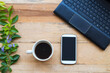 © phenphayom - mobile phone ,computer notebook for business work with hot coffee at office desk